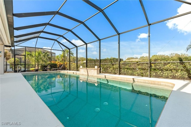 view of swimming pool with a lanai