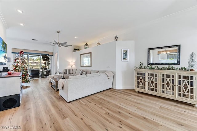 24800 Hollybrier Ln, Bonita Springs, FL 34134 - living room featuring light wood finished floors, recessed lighting, ceiling fan, and crown molding