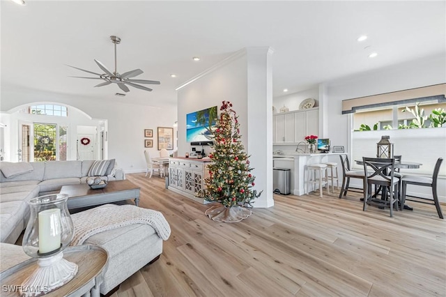 24800 Hollybrier Ln, Bonita Springs, FL 34134 - living area with light wood-type flooring, recessed lighting, arched walkways, and a ceiling fan
