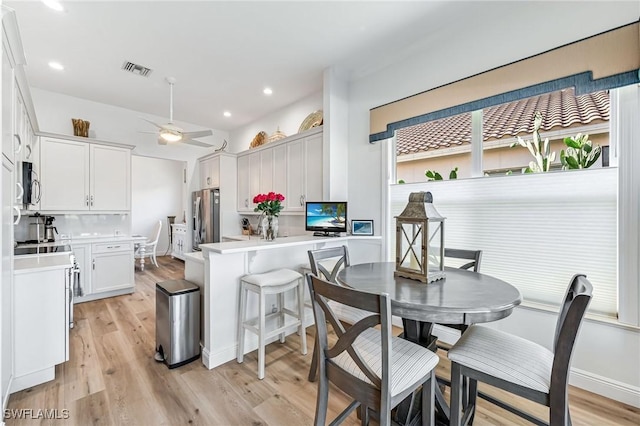 24800 Hollybrier Ln, Bonita Springs, FL 34134 - kitchen featuring appliances with stainless steel finishes, light wood-type flooring, light countertops, and recessed lighting
