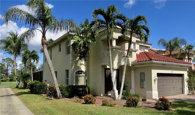 2004 Par Dr, Naples, FL 34120 - view of front of house with a garage, stucco siding, concrete driveway, and a tiled roof
