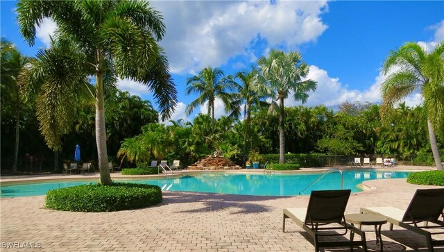 2004 Par Dr, Naples, FL 34120 - pool featuring a patio