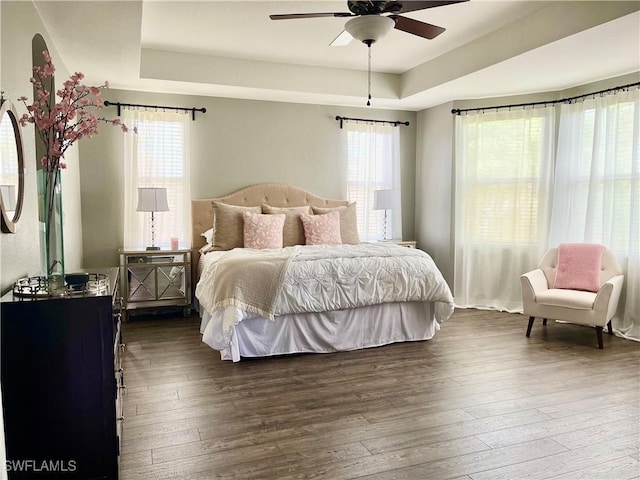 2004 Par Dr, Naples, FL 34120 - bedroom featuring wood-type flooring, a ceiling fan, and a tray ceiling