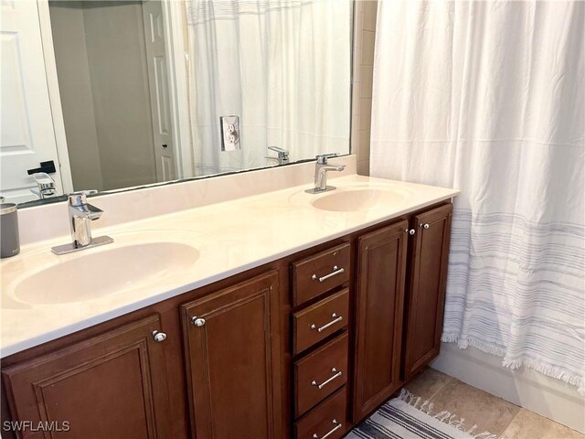 2004 Par Dr, Naples, FL 34120 - bathroom with double vanity, a sink, and tile patterned flooring