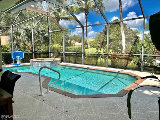 view of swimming pool with a patio, an in ground hot tub, and glass enclosure