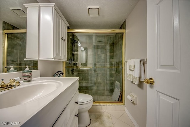 bathroom with a textured ceiling, toilet, walk in shower, tile patterned floors, and vanity