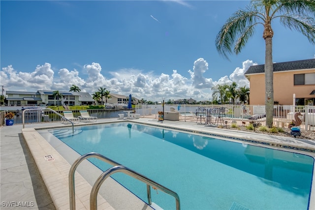 view of pool featuring a patio