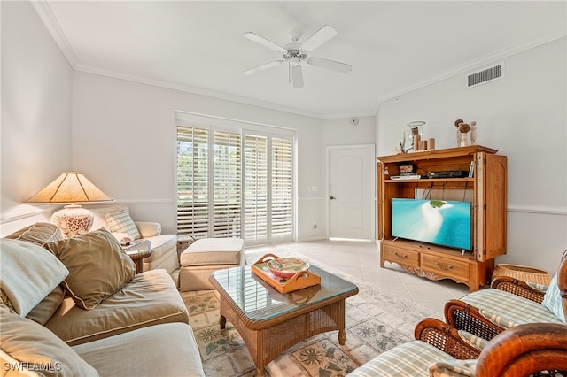 living room featuring ornamental molding, ceiling fan, and light tile patterned flooring