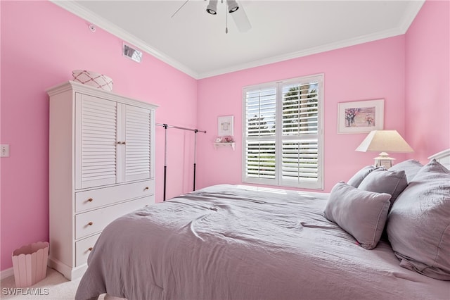 bedroom with crown molding, ceiling fan, and light colored carpet