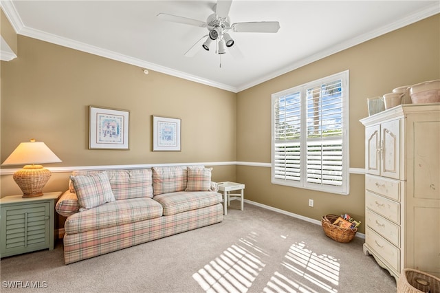 living room with ceiling fan, light colored carpet, and ornamental molding