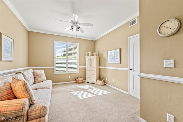 living area with ceiling fan, light colored carpet, and crown molding