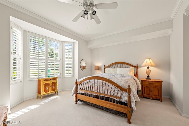 bedroom with ceiling fan, light colored carpet, and crown molding