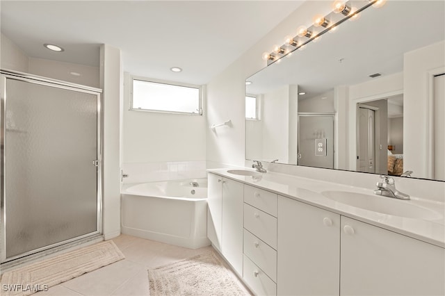 bathroom featuring tile patterned floors, vanity, and separate shower and tub