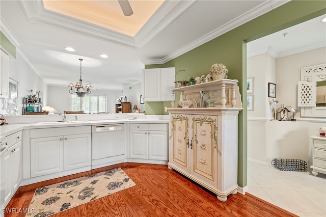 kitchen featuring white cabinets, white dishwasher, sink, light hardwood / wood-style flooring, and crown molding