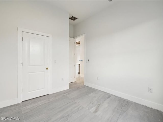 unfurnished bedroom featuring a closet