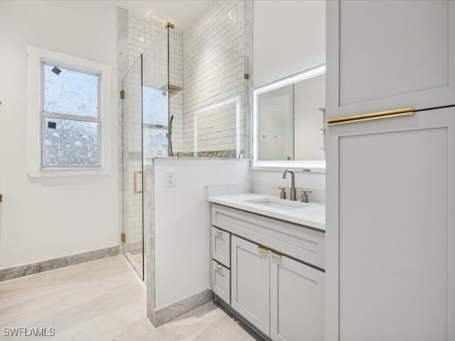 bathroom featuring vanity and an enclosed shower