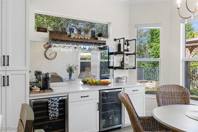 3684 Sudbury Ln, Bonita Springs, FL 34134 - indoor bar featuring beverage cooler and ornamental molding
