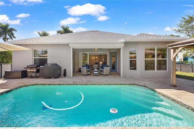 view of pool featuring a grill, outdoor lounge area, and a patio area