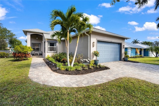 single story home with a front lawn and a garage