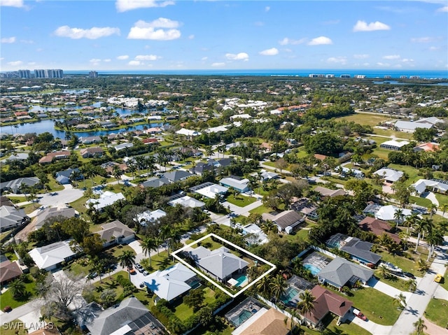 birds eye view of property featuring a water view