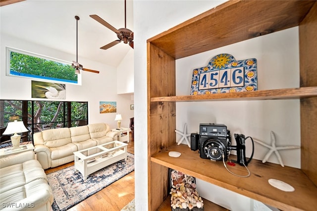 interior space featuring a wealth of natural light, vaulted ceiling, ceiling fan, and hardwood / wood-style floors