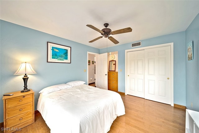 bedroom featuring a closet, ceiling fan, and hardwood / wood-style flooring