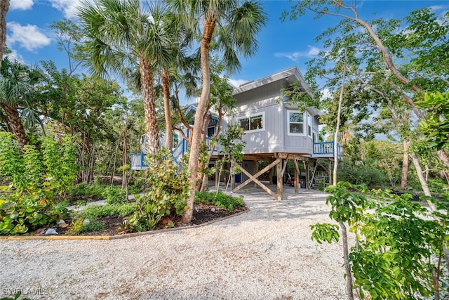 coastal inspired home featuring a carport