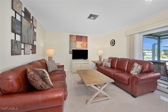 living room featuring a textured ceiling