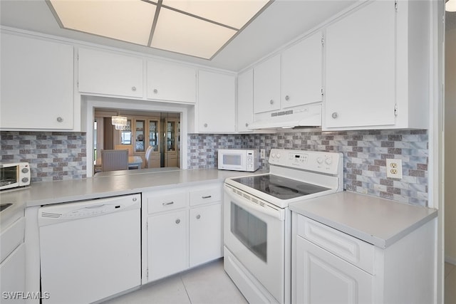 kitchen with backsplash, white appliances, white cabinetry, and ventilation hood