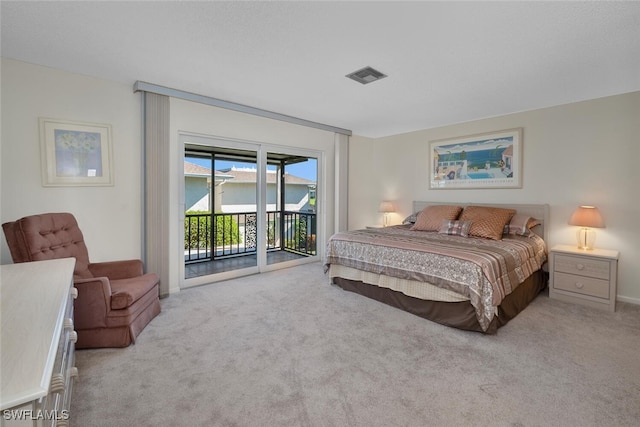 carpeted bedroom featuring access to outside