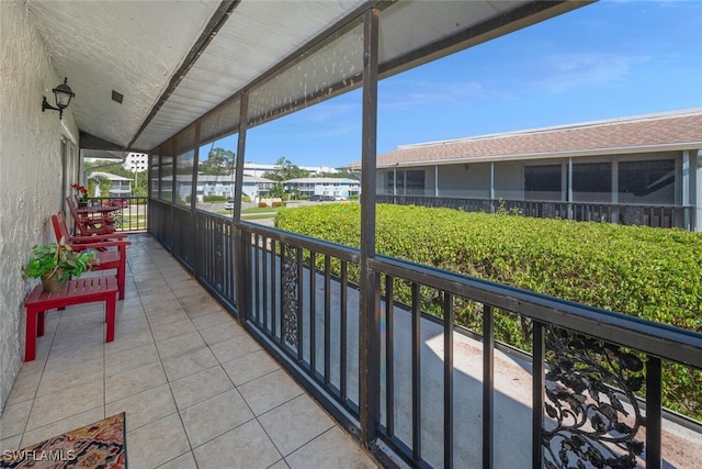 unfurnished sunroom with vaulted ceiling