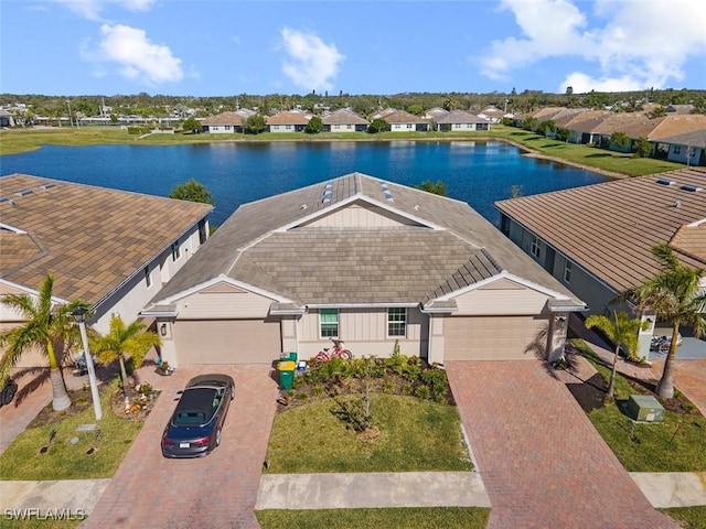 birds eye view of property with a water view