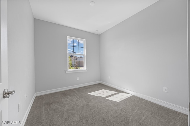 unfurnished room with carpet flooring