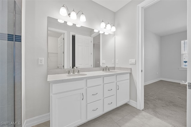 bathroom featuring tile patterned floors and vanity