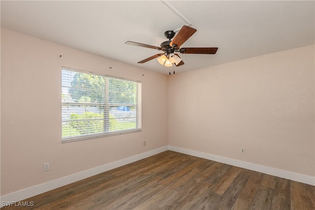 spare room with ceiling fan and dark hardwood / wood-style floors