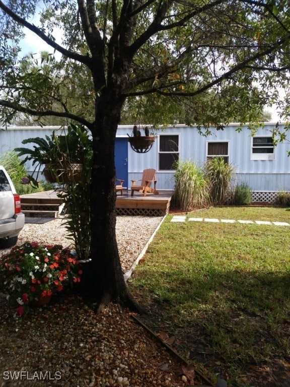 view of yard with a wooden deck