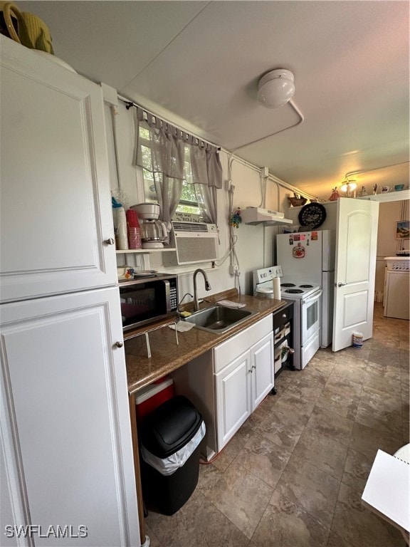 kitchen featuring washer / clothes dryer, white cabinetry, sink, and white electric range