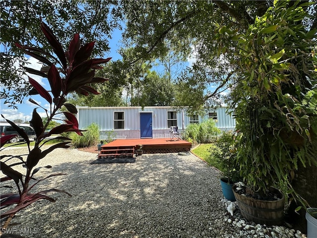 rear view of house with a deck