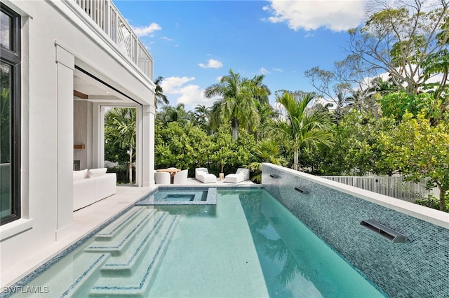 view of swimming pool featuring a pool with connected hot tub