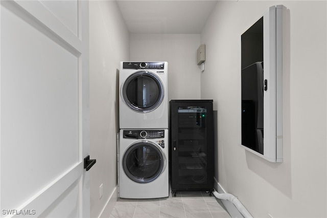 clothes washing area with wine cooler and stacked washing maching and dryer