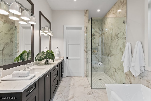 full bathroom with vanity, marble finish floor, a marble finish shower, a soaking tub, and recessed lighting