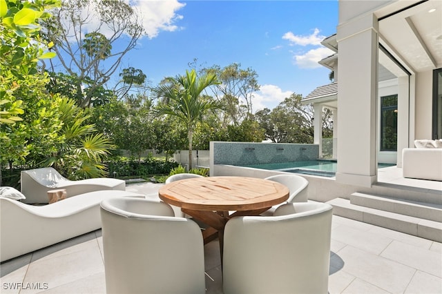 view of patio / terrace with a fenced in pool
