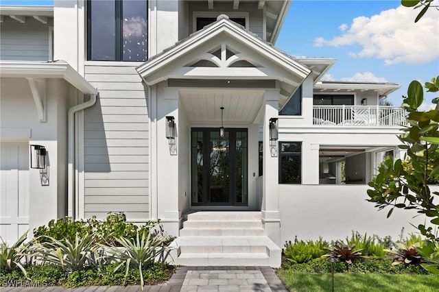 entrance to property with a carport and a balcony