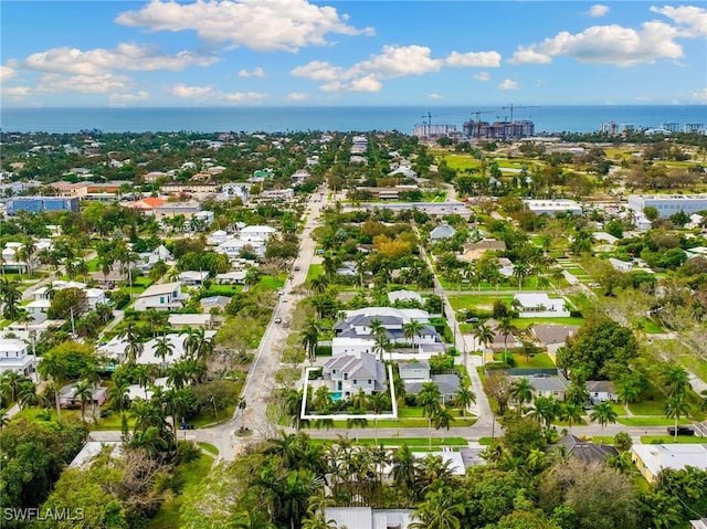drone / aerial view featuring a water view and a residential view