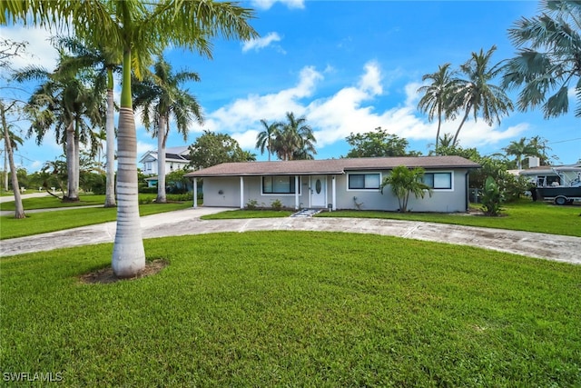 ranch-style house featuring a front lawn