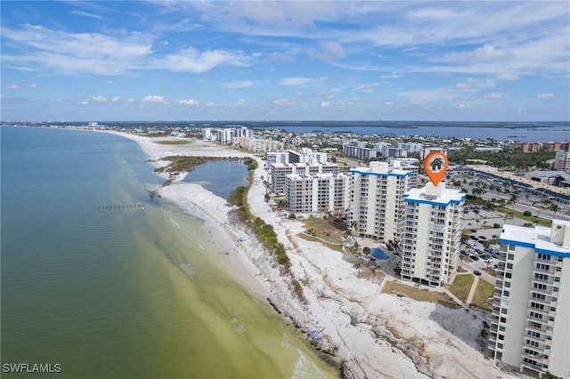 drone / aerial view with a beach view and a water view