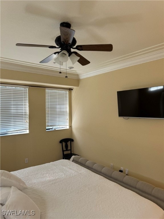 unfurnished bedroom with ceiling fan and crown molding