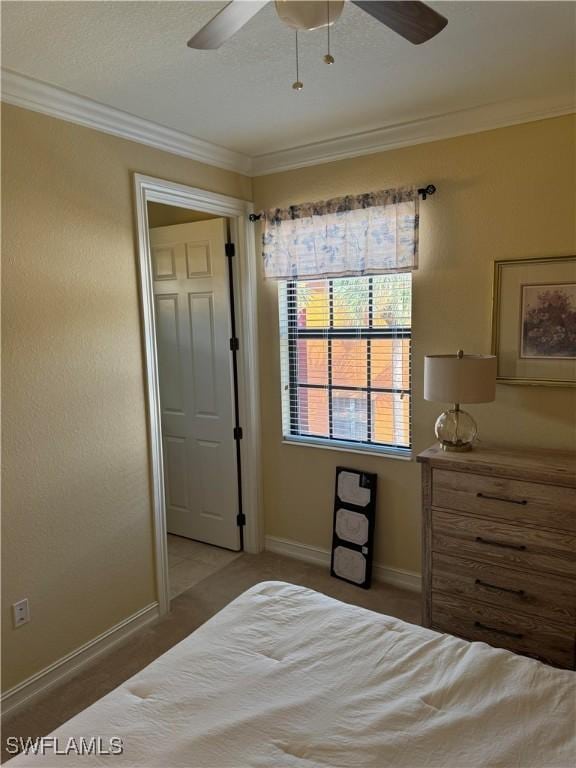 11947 Tulio Way Unit 4005, Fort Myers, FL 33912 - bedroom featuring crown molding, light colored carpet, baseboards, and a ceiling fan