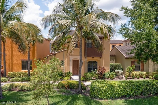 11947 Tulio Way Unit 4005, Fort Myers, FL 33912 - view of front of house with stucco siding and a tiled roof
