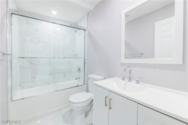 full bathroom with vanity, toilet, and combined bath / shower with glass door